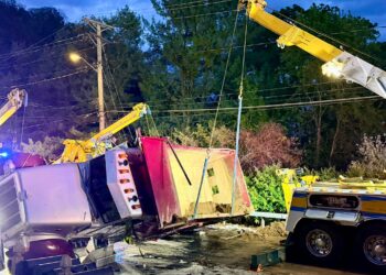 Three injured in Rosendale after driver with suspended license overturns dump truck onto car